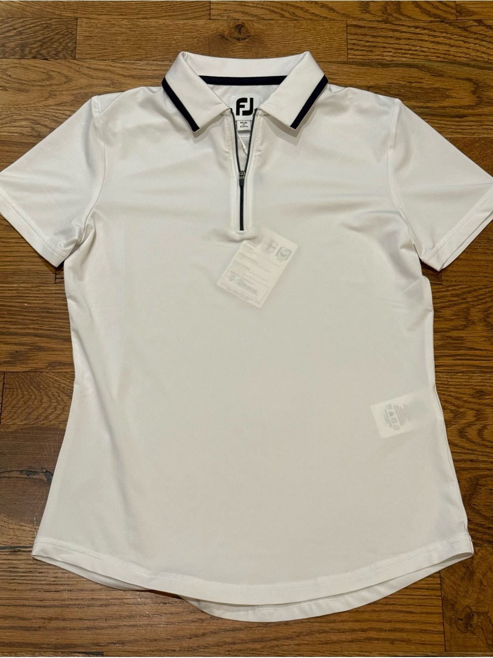 NWT. FootJoy. Short Sleeve Quarter-Zip Women. White/Navy. Size XS.